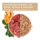 Hochwertiges Haustierfutter mit rohem Fleisch, Spinat, Pfirsich und Karotte, mit Text in Deutsch und Englisch, der das Rezept beschreibt.