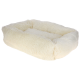 Ein weiches, flauschiges, cremefarbenes Haustierbett mit erhöhten Rändern, entworfen für Komfort und Entspannung für kleine bis mittelgroße Haustiere.
