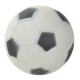 Un ballon de football en caoutchouc avec un motif hexagonal noir et blanc classique, légèrement usé avec des marques d'usure visibles.