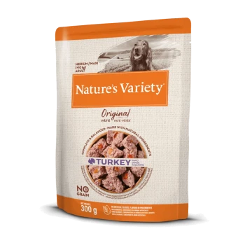 Nature's Variety Original hondenvoer, kalkoensmaak, 300g verpakking, met een textuurontwerp en een hondenafbeelding bovenaan.