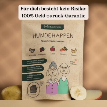Hundefutterverpackung „Hundehappen Seniorenschmaus“ mit Zutaten Kartoffel, Cranberry, Apfel, Karotte, Banane und deutschem Text zur 100% Geld-zurück-Garantie.