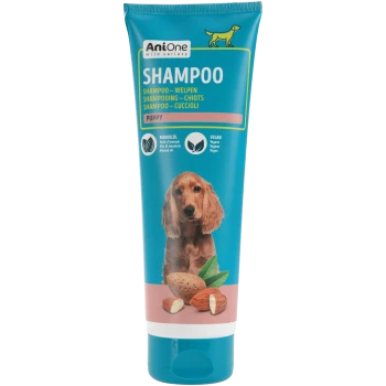 Tube de shampooing AniOne pour chiot, bleu, grand texte 'SHAMPOO', photo de chiot, image d'amande et étiquettes 'PUPPY', 'Almond oil', 'Vegan'.