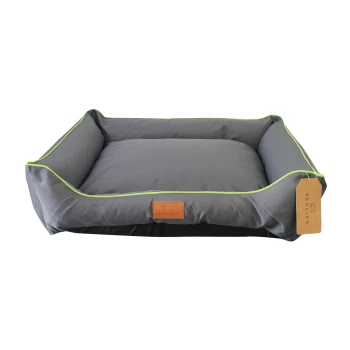 Gray pet bed with green trim and a leather tag labeled "Beddies." The bed features raised sides and a soft cushion.