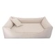 Ein plüschiges, cremefarbenes Haustierbett mit einem weichen Kissen und einem kleinen passenden Kissen, entworfen für Komfort und Entspannung.