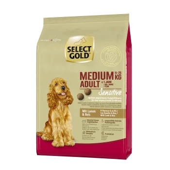 Tüte Select Gold Medium Adult Hundefutter, 11-25 kg, mit der Aufschrift "Sensitive" und Zutaten aus Lamm und Reis, mit einem Hundebild.