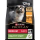Purina Pro Plan Medium Welpenfutter, 12 kg Sack, mit einem Welpenbild und Etiketten: "Hoher Proteingehalt", "Huhn Nr. 1 Zutat", "Gesunder Start."