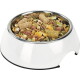 White pet bowl filled with mixed small-animal food: pellets, seeds, flakes, corn and dried mealworms.