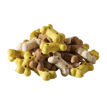 Ein Haufen bunter Hundeknochen-Leckerlis in Gelb, Braun und Weiß, die verschiedene Texturen und Größen zeigen.
