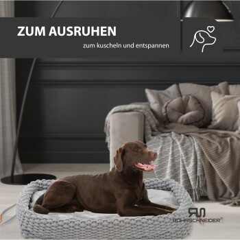 Ein entspannter brauner Hund, der auf einem gemütlichen grauen Hundebett liegt, mit dem Text "ZUM AUSRUHEN" und "zum kuscheln und entspannen" darüber.