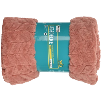 Couverture pour animaux douce et rose enroulée avec une étiquette teal qui indique "Liege Decke" et comprend des instructions d'entretien et des détails sur le produit.