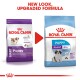 Royal Canin Puppy food packaging comparison, showing new design and upgraded formula for giant dogs, with text highlighting benefits.