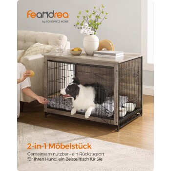 Ein stilvolles 2-in-1 Haustierkäfig und Beistelltisch mit einem schwarzen Drahtgestell, einem gemütlichen Hund darin und einer modernen Wohnzimmereinrichtung.