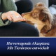 Brauner Hund schnüffelt an einem Tablet in der Hand einer Person; blaues Banner lautet 'Hervorragende Akzeptanz Mit Tierärzten entwickelt'.