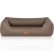 Braunes Hundebett mit einem gesteppten Design und erhöhten Seiten, mit einem kleinen orangefarbenen Logoetikett, das "KNUFFELWUFFS" liest.