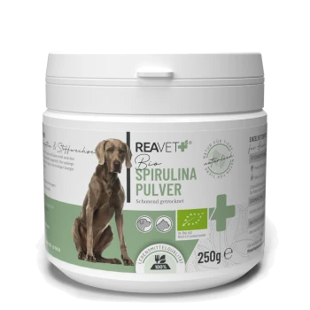 Behälter mit REAVET Bio Spirulina-Pulver für Haustiere, 250g, mit einer Hundesilhouette und dem Hinweis, dass es schonend getrocknet ist.