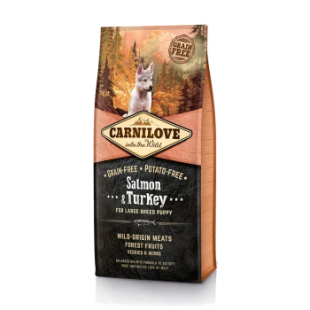 Hondenvoerzak met het label 'Carnilove into the Wild,' met 'Zalm & Kalkoen' voor grote rassen puppy's, graanvrij en aardappelvrij.