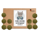 Pappverpackung mit einer Cartoon-Katze in Brille und Schal, beschriftet mit "KATER KASIMIR KATZENMINZE MURMELN," und grünen Katzenminzbällen.