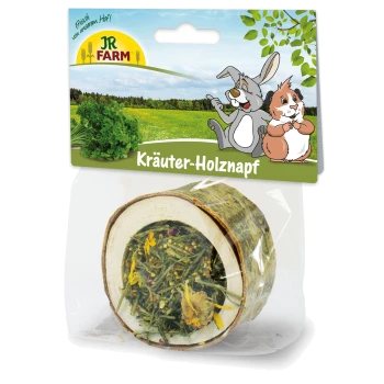 Holzschüssel gefüllt mit getrockneten Kräutern, verpackt mit einem bunten Etikett, das einen Hasen und ein Meerschweinchen zeigt, beschriftet mit "Kräuter-Holznapf."
