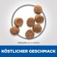 Tierfutterpellets, die in einem Kreis angeordnet sind, messen etwa 4 x 6,5 mm, mit dem Text "KÖSTLICHER GESCHMACK" darunter.