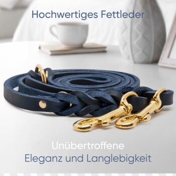 Marineblaue Lederhundeleine mit goldenen Verschlüssen, mit dem Text: "Hochwertiges Fettleder" und "Unübertroffene Eleganz und Langlebigkeit."