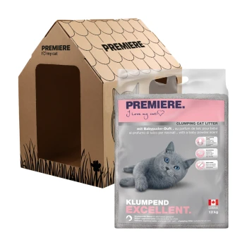 Kartonowy domek dla kota z napisem "PREMIERE. I love my cat" obok 12 kg worka żwirku dla kotów o zapachu pudru dla niemowląt.