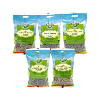 Mix 5 Soft-snacks für Hunde - Freiland-Happen 200g + Heide-Happen 200g + Wildbach-Happen 200g + Landgut-Happen 200g + Gutshof-Happen 200g Fünf bunte Snacks für Haustiere in Tüten, die mit verschiedenen Fleischsorten beschriftet sind: Huhn, Lamm, Lachs, Truthahn und Rind & Truthahn.