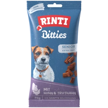 Blaue RINTI Bitties Hundeleckerli-Packung, Aufdruck 'Senior Extra Soft', 'Mit Huhn & Truthahn', 'Ohne Zuckerzusatz', 75 g, mit Hundeabbildung.