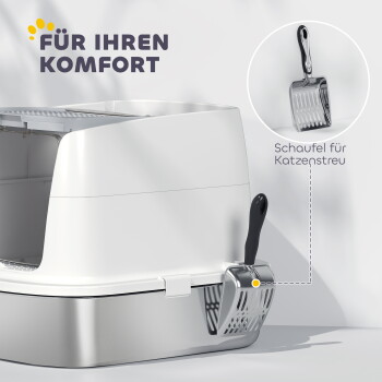 Weiße geschlossene Katzentoilette mit angebrachtem Metallschaufel; sichtbarer Text: 'FÜR IHREN KOMFORT' und 'Schaufel für Katzenstreu'.