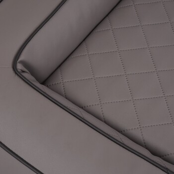 Graues Haustierbett mit gestepptem Design und schwarzer Paspel, mit einer weichen, gepolsterten Oberfläche für Komfort.