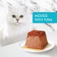 A fluffy white cat with green eyes sits beside a plate of tuna mousse, topped with a glossy sauce, with the text "MOUSSE WITH TUNA" in a blue box.