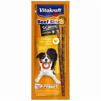 Vitakraft Beef Stick School honden traktatie verpakking met een blije hond met een speeltje, gelabeld 'Suikervrij Recept' en 'Vitality Plus.'