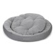 Graues rundes Haustierbett mit einem plüschigen, gepolsterten Kissen, mit dem Logo "Doctor Bark" an der Seite.