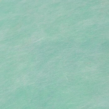 Eine Nahaufnahme einer weichen, mintgrünen Stofftextur, ohne sichtbaren Text oder identifizierbare Haustierprodukte.