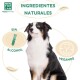Ein schwarz-weißer Hund sitzt stolz, umgeben von Text, der "INGREDIENTES NATURALES", "SIN ALCOHOL" und "VEGANOS" liest.