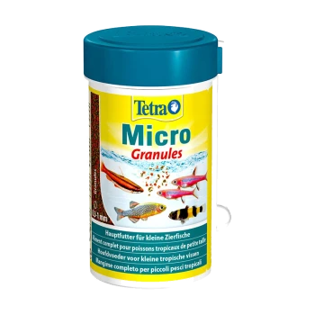 Tetra Micro Granules visvoercontainer, met een blauwe deksel en gele label, met afbeeldingen van kleine tropische vissen en tekst in meerdere talen.