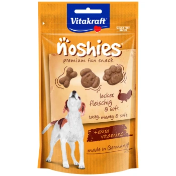 Vitakraft Noshies Premium-Snackpaket mit einem Hund, mit dem Text 'lecker, fleischig & weich' und '+extra Vitamine'.