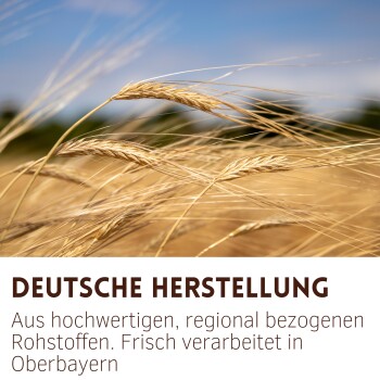 Nahaufnahme von goldenen Weizenähren mit deutschem Text über hochwertige, regional bezogene Zutaten, verarbeitet in Oberbayern.