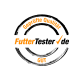 Logo FutterTester.de z napisem 'Geprüfte Qualität' i 'GUT' w kolorze pomarańczowym i czarnym, wskazujące na zapewnienie jakości karmy dla zwierząt.