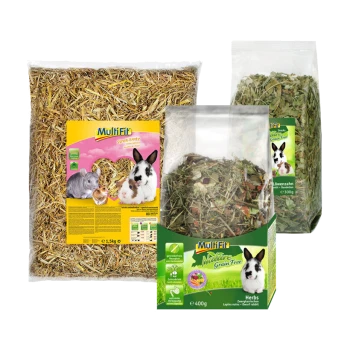 Three Multifit pet food products: 1.5 kg straw bag with rabbits, 400 g grain-free herbs, and 300 g dandelion snacks.