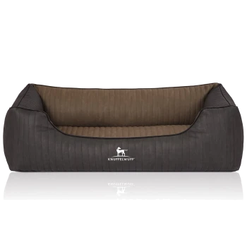 Ein stilvolles Hundebett mit einem dunkelgrauen Äußeren und einem weichen braunen Innenraum, das das Logo "KNUFFELWUFFF" auf der Vorderseite zeigt.