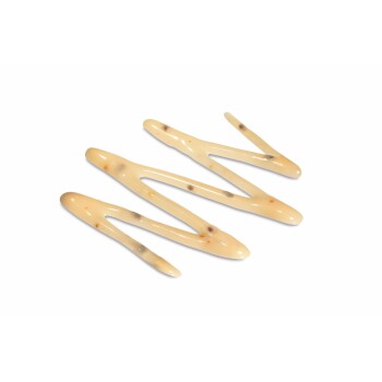 Three beige wavy dog chew sticks with dark flecks on white background