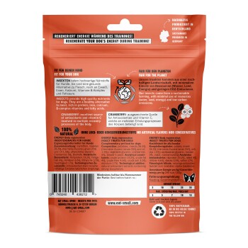 Rückseite einer Haustierfutterverpackung mit insektenbasierten Hundeleckerlis. Der Text hebt die Energie-Regeneration, natürliche Zutaten und Nachhaltigkeit hervor.