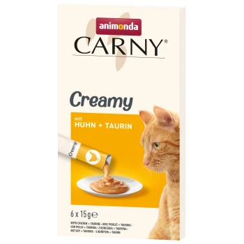 Animonda Carny Creamy Katzenfutterverpackung mit einer orangefarbenen Katze und cremigem Futter. Text: "mit Huhn + Taurin" und "6 x 15g."