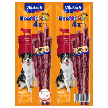 Beef-Stick 2x4 Stk. Rind Vitakraft BeefStick Hundeleckerlitasche mit vier Rindersticks, mit einem Hund auf jeder Seite, und Text, der 90% Fleisch und zuckerfreies Rezept hervorhebt.