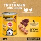 Nourriture en conserve pour chiens de Pedigree avec de la dinde et du poulet, étiquetée "100% complète," avec des ingrédients naturels et un emballage recyclable.