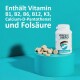 Flasche des GREEN HERO Gelenk Komplex Haustier-Nahrungsergänzungsmittels mit beigen Tabletten auf einem türkisfarbenen Sockel, mit Text über Vitamine und Zutaten.