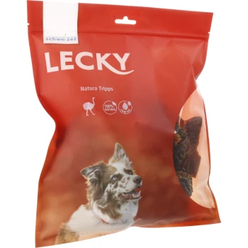 Emballage rouge pour friandises pour chiens étiqueté "LECKY Natura Tripps," présentant un chien souriant et des icônes indiquant 100% naturel et faible en gras.