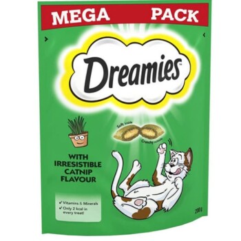 Green packaging for Dreamies cat treats, showcasing a playful cat and highlighting "irresistible catnip flavor," vitamins, and 2 kcal.