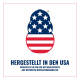 US-Flaggen-Pfotenlogo über deutschem Text 'HERGESTELLT IN DEN USA' und einer kleineren Zeile über weltweit bezogene Zutaten.