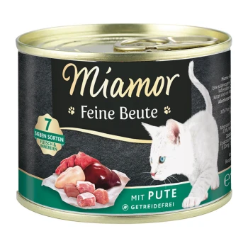 Feine Beute Pute 12x185 g Dose Katzenfutter mit der Aufschrift "Miamor Feine Beute", mit einer weißen Katze und verschiedenen Fleischstücken. Der Text hebt "7 Sorten" und "mit Pute" hervor.